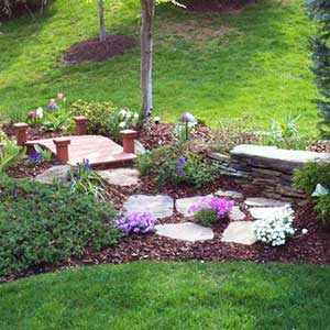 grassy lawn with natural stone pavers