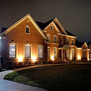 brick house lit at night